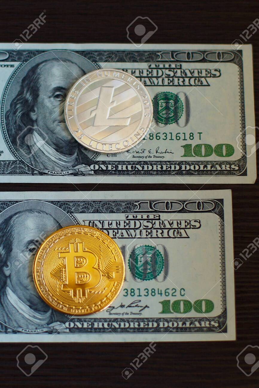 Golden Bitcoin And Silver Litecoins On Us Dollars Close Up Exchange - 